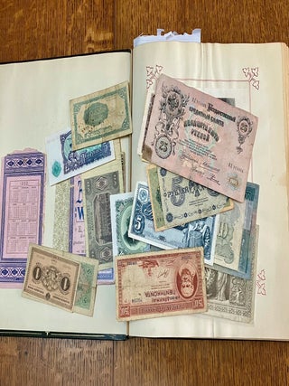 ALBUM OF TRAVEL AND EXPLORATION MATERIAL. Printed and manuscript items; Photographs, letters, documents, drawings, Loose bank notes, printed views and maps. China, Russia, West Indies, Europe, U.S.A, Africa....